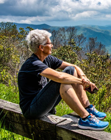 Woman looking out over the mountains