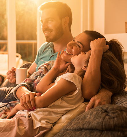 Family together on their couch.